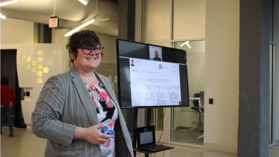 Woman giving a presentation in front of a screen
